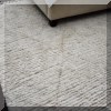 DR01. Cream colored rug. Approx. 13' x 9'3” 